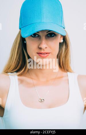 SportsWoman in blue cap standing in studio Stock Photo