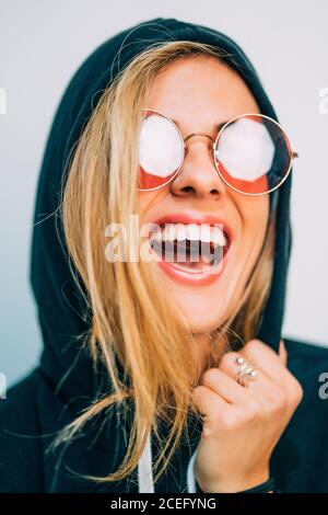 Young Woman in sunglasses looking at camera Stock Photo