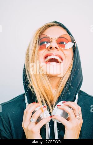 Young Woman in sunglasses looking at camera Stock Photo