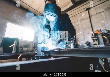 man doing a solder in metal. Stock Photo