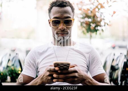 African man using mobile phone. Stock Photo