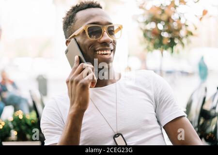 African man using mobile phone. Stock Photo