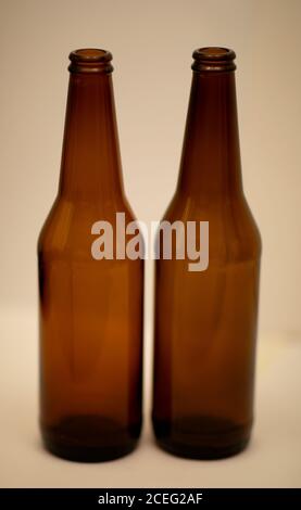 Two dark empty beer bottles. Stock Photo