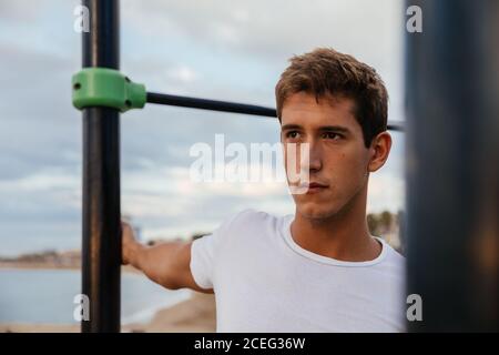 Male athlete doing stretching outside. Stock Photo