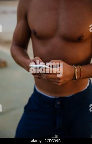 Athlete man training outdoors with mobile. Stock Photo