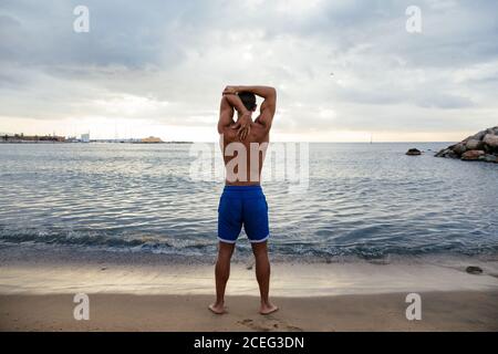 Male athlete doing stretching outside. Stock Photo