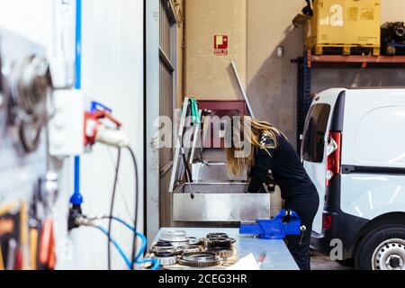 Woman working in a mechanical workshop Stock Photo