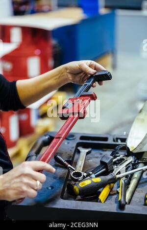 Woman with tools in a mechanical garage Stock Photo