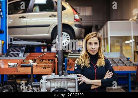 Woman working in a mechanical workshop Stock Photo