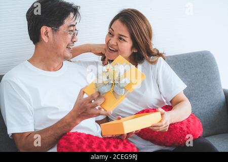 Happy Asian senior people having good time at home Stock Photo