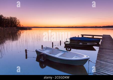 Jetty at sunset at Lake Ratzeburg / Ratzeburger See at Lauenburg Lakes Nature Park / Naturpark Lauenburgische Seen, Schleswig-Holstein, Germany