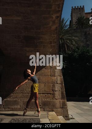 Woman dancing ballet on street Stock Photo