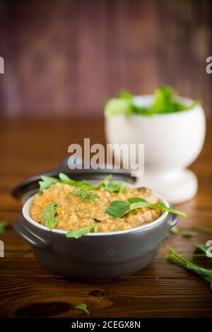 boiled bulgur groats with vegetables and herbs Stock Photo