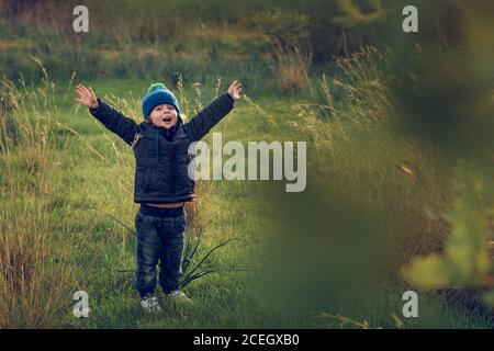 boy having fun in sunny park Stock Photo