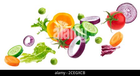 Falling vegetables, fresh salad ingredients isolated on white background Stock Photo