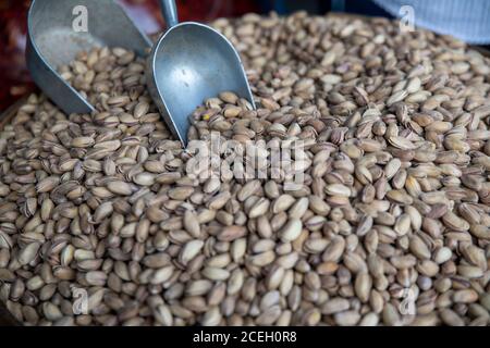 Healthy and delicious roasted salted pistachio nuts, background and texture Stock Photo