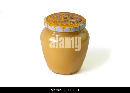 Jar of honey with flowers of acacia isolated on white background. Front views, close-up Stock Photo