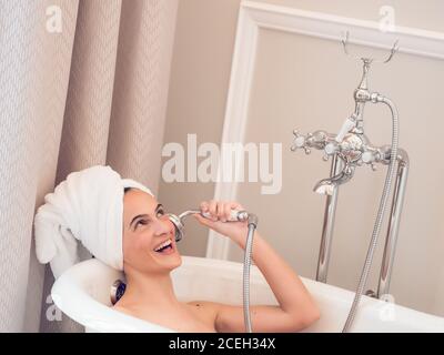 Laughing young Woman having bath Stock Photo
