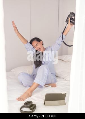 Young Woman wearing blue pajamas Stock Photo