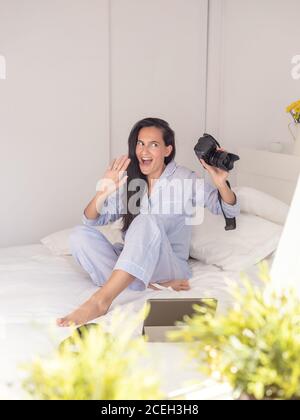 Young Woman wearing blue pajamas Stock Photo