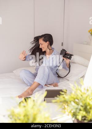Young Woman wearing blue pajamas Stock Photo