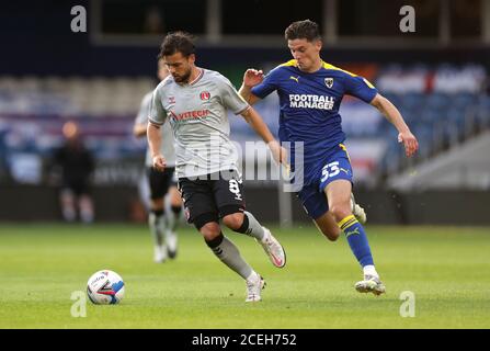 Charlton Athletic's Jake Forster-Caskey (left) and AFC Wimbledon's Callum Reilly battle for the ball during the EFL Trophy, Southern Group G match at The Kiyan Prince Foundation Stadium, London. Stock Photo