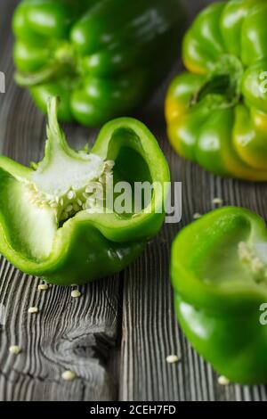 Sweet green pepper on wooden background. Fresh yellow green bell pepper (capsicum) Stock Photo