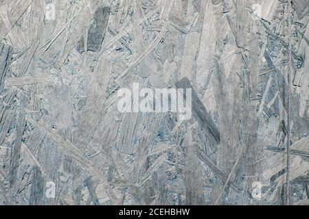 Pressed wooden panel background, seamless texture of oriented strand board - OSB Stock Photo