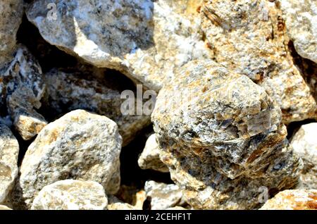 Natural gray gypsum stone. Close up image of stones with black and white. Industrial mining area. Limestone mining, quarry - Image Stock Photo