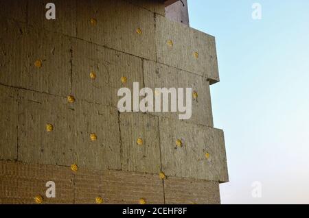 Mineral wool insulation of the facade building on construction site. Background, texture, small sharpness. Stock Photo
