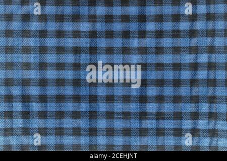 The texture of checkered fabric as a background. Checked fabric tablecloth. Fabric in a small square. Texture plaid fabric. Texture background of kitc Stock Photo