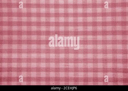 The texture of checkered fabric as a background. Checked fabric tablecloth. Fabric in a small square. Texture plaid fabric. Texture background of kitc Stock Photo