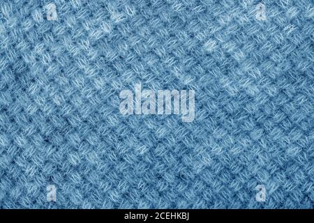 Wool sweater texture close up. Knitted jersey background with a relief pattern. Braids in machine knitting pattern Stock Photo