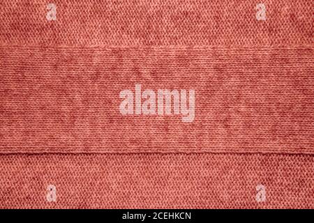 Wool sweater texture close up. Knitted jersey background with a relief pattern. Braids in machine knitting pattern Stock Photo