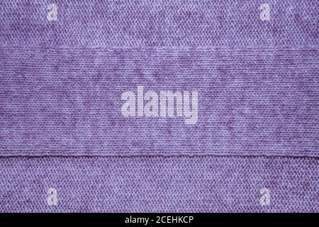 Wool sweater texture close up. Knitted jersey background with a relief pattern. Braids in machine knitting pattern Stock Photo