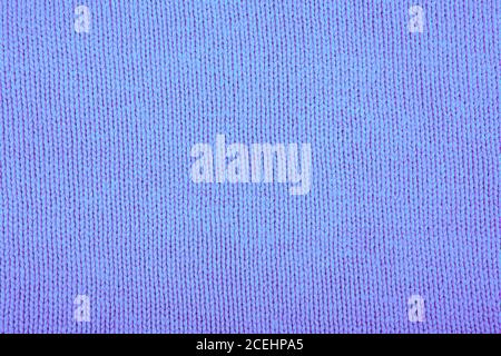 Wool sweater texture close up. Knitted jersey background with a relief pattern. Braids in machine knitting pattern Stock Photo