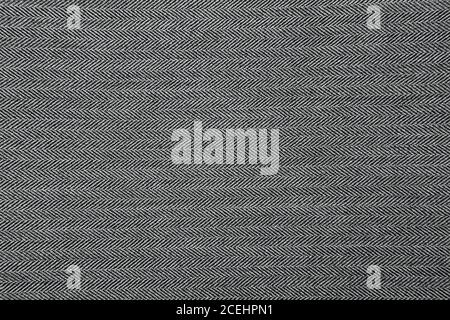 Grey herringbone fabric pattern texture background closeup Stock Photo