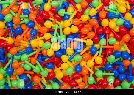 colorful children's mosaic pieces background texture. Small plastic details of children's mosaic Stock Photo