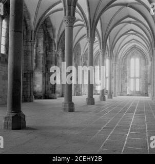 France,1950s, historical view of inside the ancient Benedictine abbey at Le Mont-Saint-MIchel, Normandy, a tidal island and commune. The island lies off France's northwestern coast, at the mouth of the Couesnon River. St Michael's Mount in Cornwall, UK is similar to Mont-Michel. Stock Photo