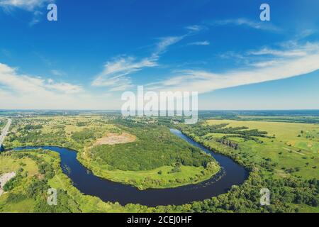 Panorama landscape of a winding river (meandering river) on a sunny day. View from above. Beautiful nature. Europe Stock Photo