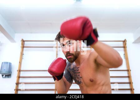 Young man boxing workout in an gym Stock Photo