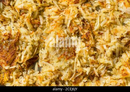 Homemade Fried Shredded Hashbrowns and Eggs for Breakfast Stock Photo