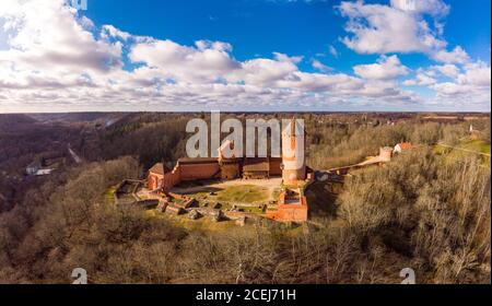Aerial view over River Gauja valley, with Turaida Castle in the middle of it during cloudy summer day, Sigulda, Latvia. Stock Photo