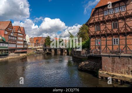 The old town of Lüneburg, Stintmarkt area at the river Ilmenau, historic harbor district, many restaurants, pubs, cafés, Lower Saxony, Germany, Stock Photo