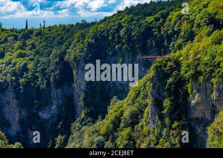 Zeda-gordi, Georgia: Tourists On Observation Platform In The End Of Narrow Suspension Bridge Or Pendant Road Up To 140 Meters Above Precipice On Stock Photo