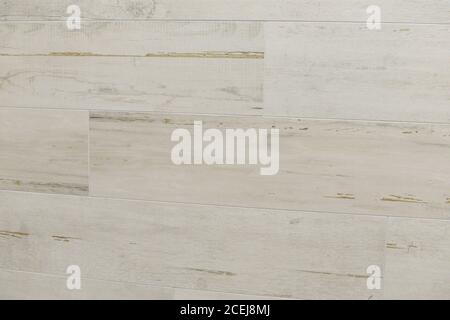 Background of a white wooden wall from modern tiled blocks in room. Finish wall tiles abstract texture. Luxury light themed background for interior an Stock Photo