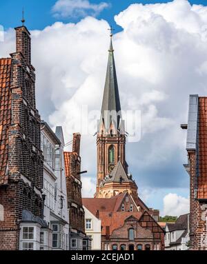 The old town of Lueneburg, panoramic view over the Luenertorstrasse to the St. Nicolai Church, historical harbour district, Lower Saxony, Germany, Stock Photo