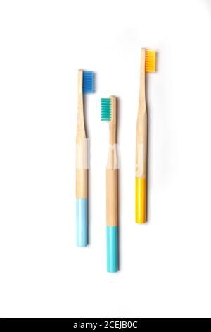 care for the environment - wooden bright toothbrushes on a yellow ...