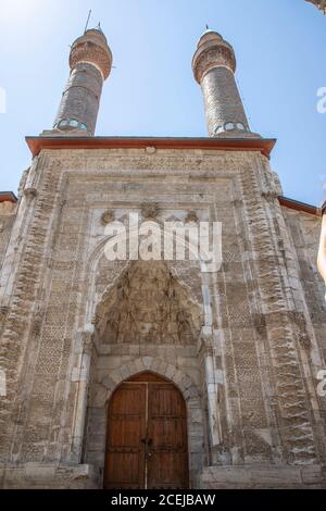 Sivas / Turkey - August 3, 2020, Double Minaret Madrasah was built in 1271 İlhanlı period. The tile decorations on the minarets are remarkable. Sivas, Stock Photo