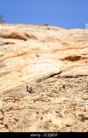 Stanage Top Rope Rock climbing belay and safety anchor ropes fixed at the top of a crag ...